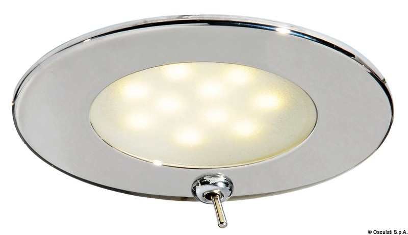 Corpo in acciaio inox. Lente in vetro satinato.Doppio sistema di fissaggio: con viti nascoste o con molle interne inox.